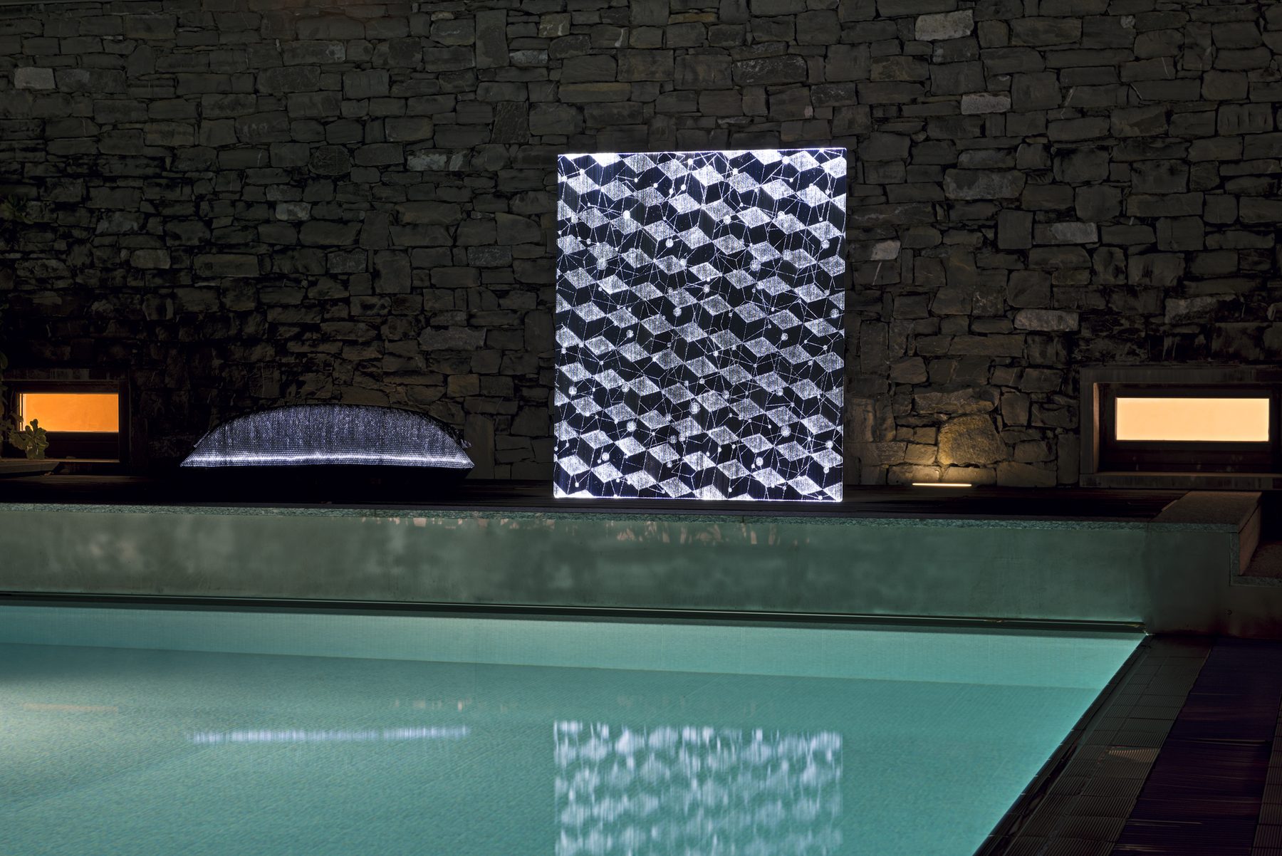 Illuminated stellar-cube art panel on a feature wall
